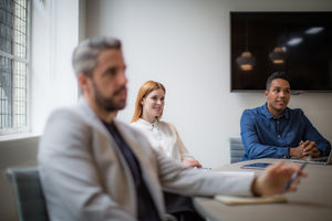 Colleagues listening in a business meeting