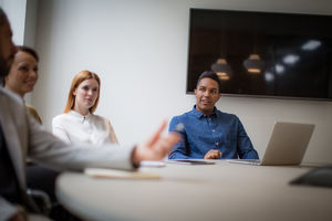 Colleagues having a discussion in a business meeting