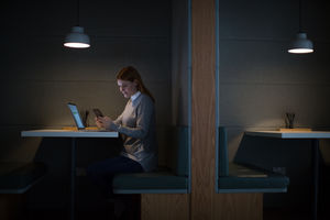 Businesswoman working late at night in office alone