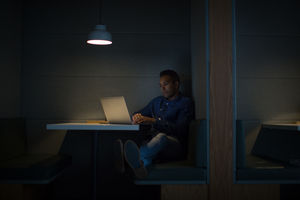 Businessman working late at night in office alone
