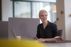 Businesswoman talking with colleague at work