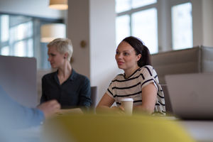 Business colleagues in a morning meeting with coffee