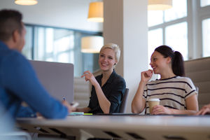 Business colleagues in a morning meeting with coffee