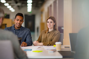 Business colleagues in a casual meeting with coffee
