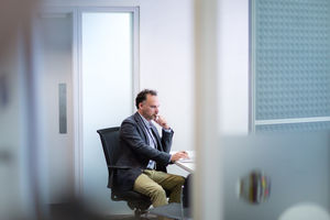 Male Medical Doctor working in his office