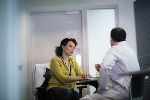 Medical Doctors discussing patient treatment together