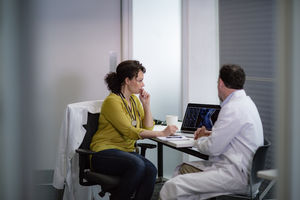 Medical Doctors discussing patient treatment together