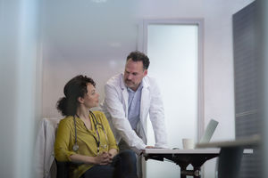 Medical Doctors discussing patient treatment together