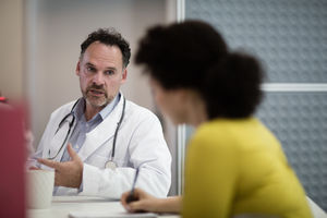 Medical Doctors discussing patient treatment together