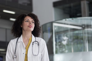 Portrait of Female Doctor walking through Hospital