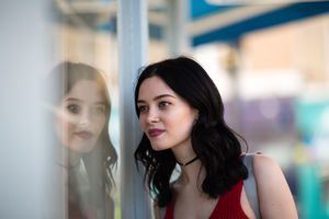 Young adult female window shopping in summer