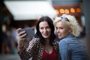 Female friends taking a selfie on a night out