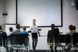 Speaker at business conference demonstrating new technology