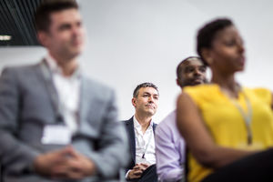 Businessman listening to a motivational speaker
