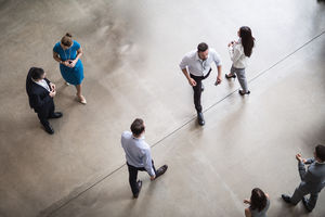 Overhead shot of busy office lobby, atrium, reception