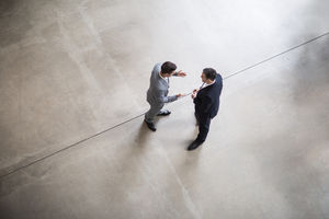 Overhead shot of two businessmen in a meeting