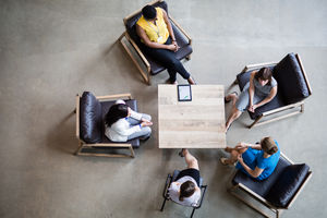 Overhead shot of group of businesswomen in a meeting