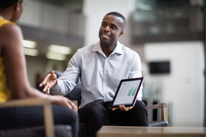 Business meeting in office atrium reception