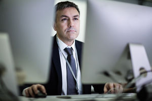 Businessman using computer late at night