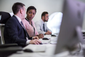 Colleagues in an office talking together