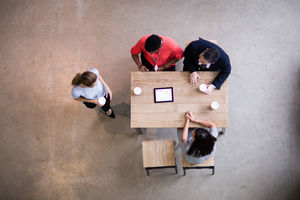 Overhead shot of woman arriving to a business meeting
