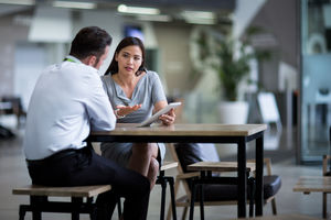Businesswoman in a meeting using a digital tablet