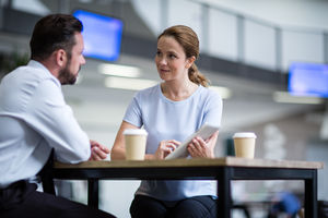 Businesswoman in a meeting using a digital tablet