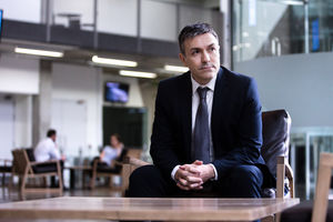Businessman looking out of window 