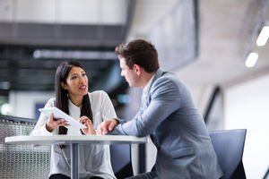 Colleagues in an informal business meeting using a digital tablet