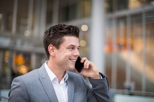 Businessman walking and on phone call