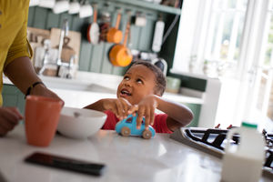 Boy playing at breakfast time 