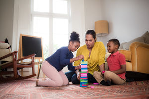 Mum with Kids building a tower