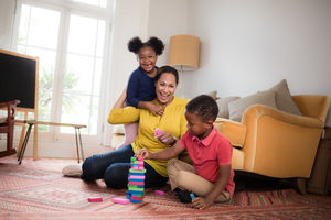 Mum with Kids building a tower