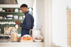 African American male checking phone in the morning