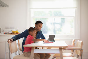 Father helping Son with school work