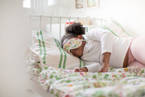 Girl taking a nap with an eye mask