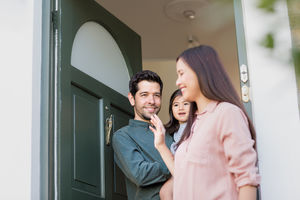 Father with Daughter waving goodbye to Mother