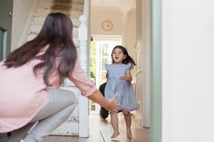 Girl running to welcome Mum home