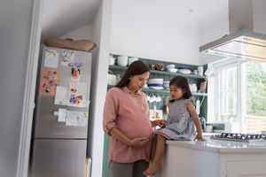 Pregnant mother with daughter