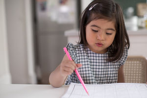 Girl learning how to write 