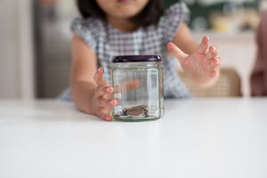 Girl reaching for her pocket money