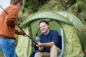 Father teaching Son how to fish