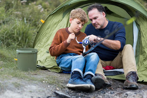 Father teaching Son how to fish
