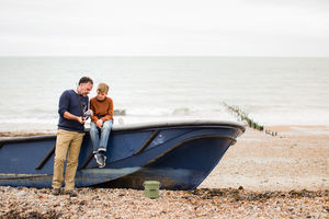 Father and Son sitting on boat getting ready for fishing trip