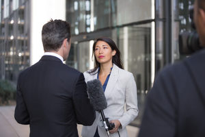 News presenter interviewing on the street
