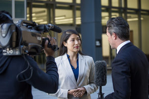 News presenter interviewing on the street