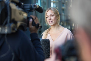 TV presenter talking to camera