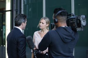 News presenter interviewing on the street