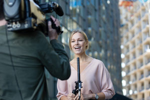 Female news presenter talking to camera