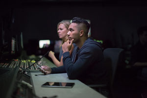 Operators in a control room at a television studio